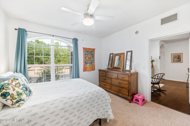 bedroom with hardwood / wood-style floors and ceiling fan