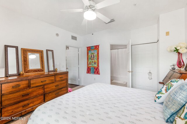 bedroom with ceiling fan and a closet