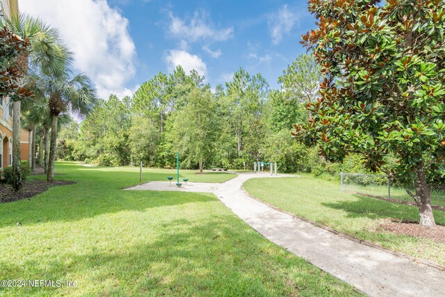 view of home's community featuring a yard