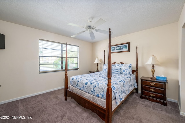 carpeted bedroom featuring a textured ceiling and ceiling fan