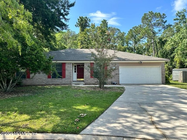 single story home with a front yard and a garage