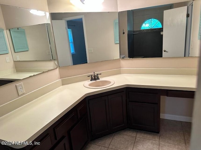 bathroom with vanity and tile patterned flooring