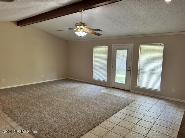 interior space featuring lofted ceiling with beams, a textured ceiling, ceiling fan, and light tile patterned flooring