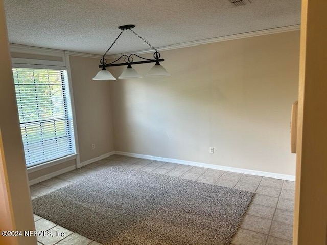 tiled empty room with crown molding, a textured ceiling, and a notable chandelier