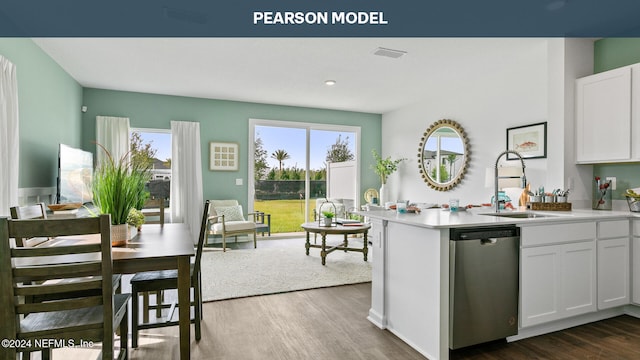 kitchen featuring a wealth of natural light, white cabinetry, dishwasher, and sink