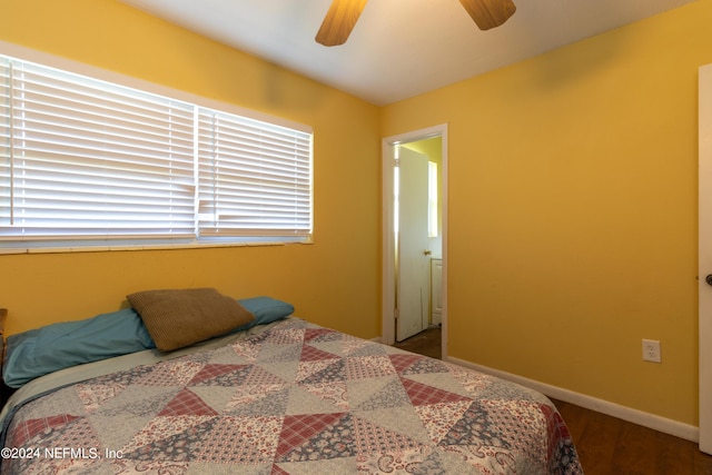 bedroom featuring wood finished floors, baseboards, and ceiling fan