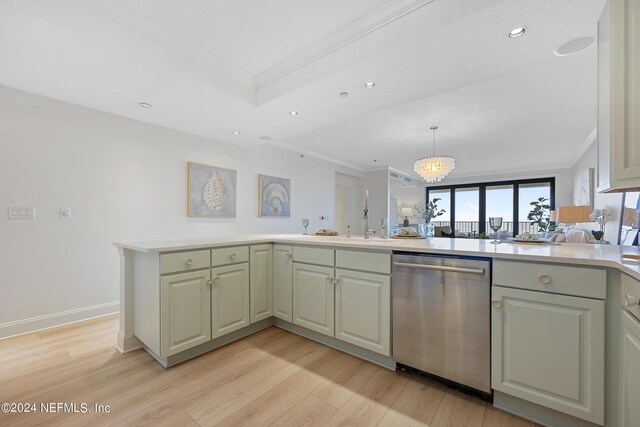 kitchen with dishwasher, an inviting chandelier, light hardwood / wood-style floors, kitchen peninsula, and ornamental molding