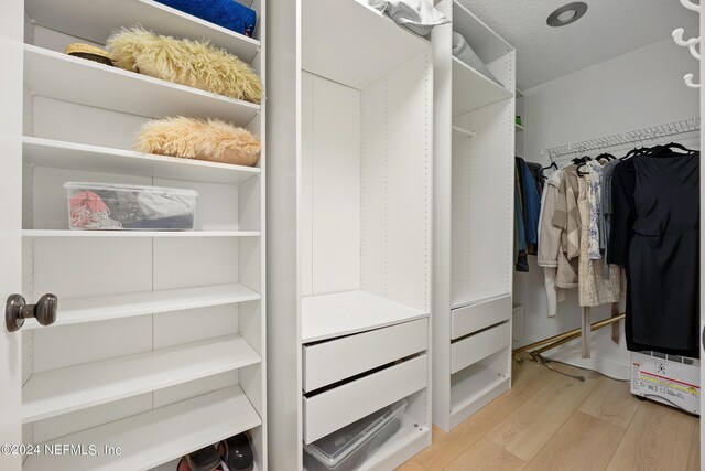 walk in closet featuring light wood-type flooring