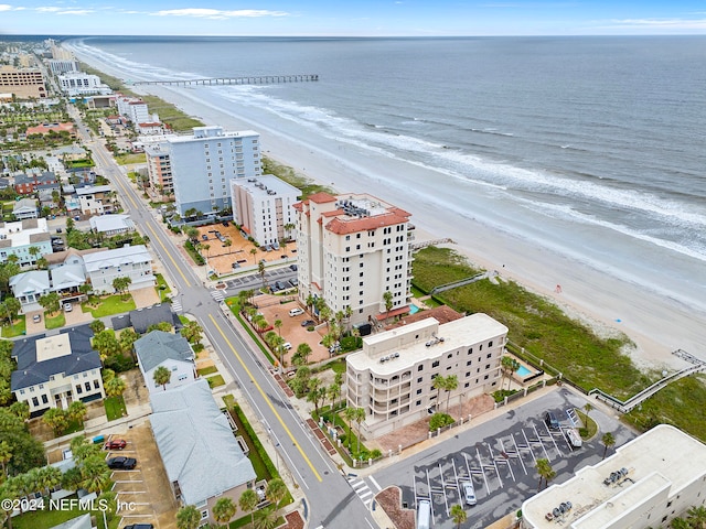 aerial view featuring a view of the beach and a water view