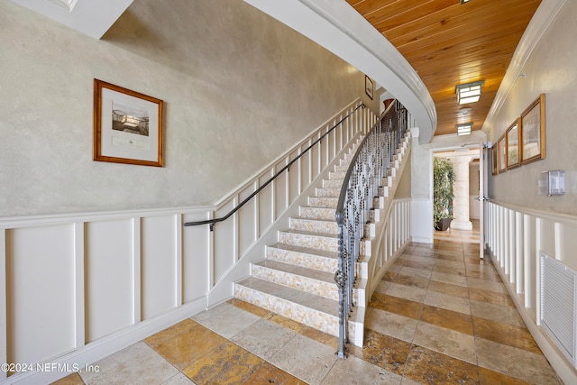 stairs featuring wooden ceiling