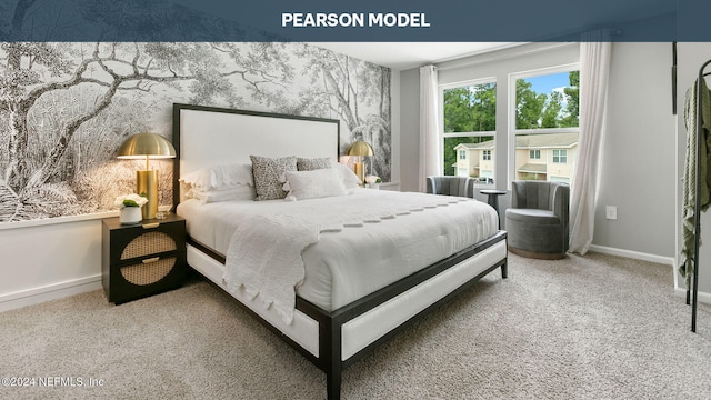 bedroom with carpet floors, an accent wall, and baseboards