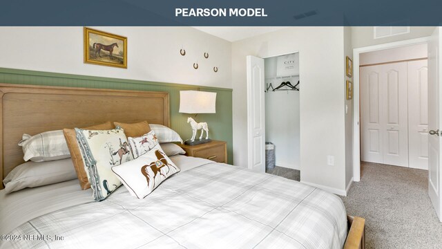 carpeted bedroom featuring visible vents