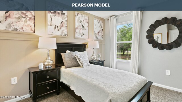 bedroom featuring carpet and baseboards