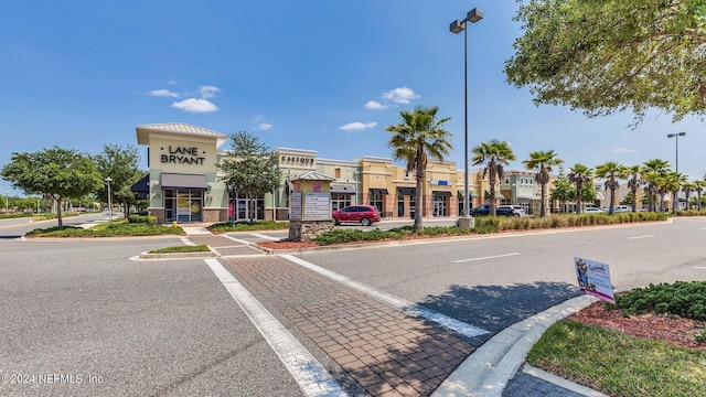 exterior space with street lights and curbs