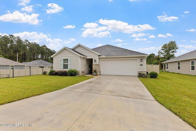 view of front of home featuring a garage and a front yard