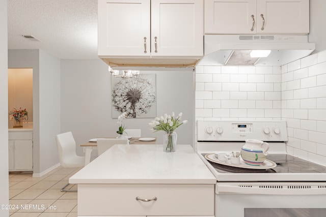 kitchen featuring a textured ceiling, light tile patterned floors, white electric range oven, and white cabinetry