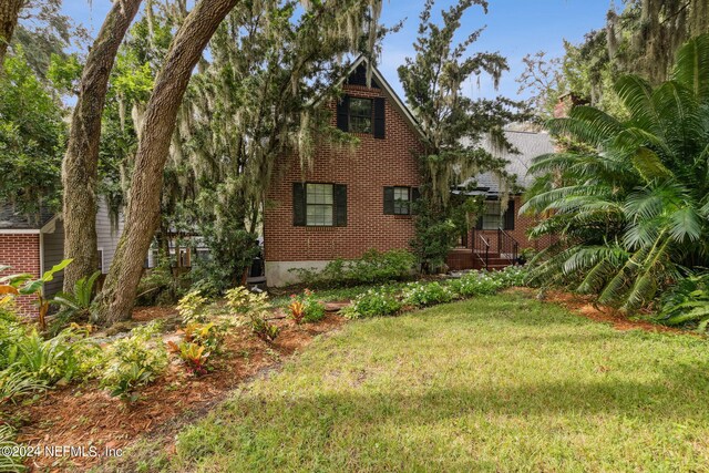 exterior space with a front yard