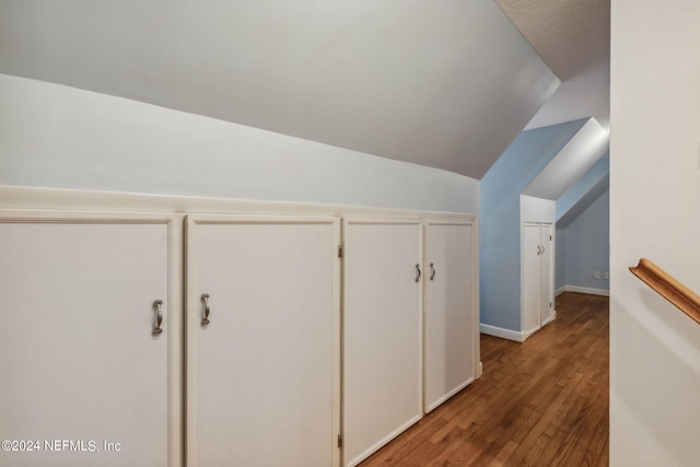 bonus room featuring lofted ceiling and hardwood / wood-style flooring