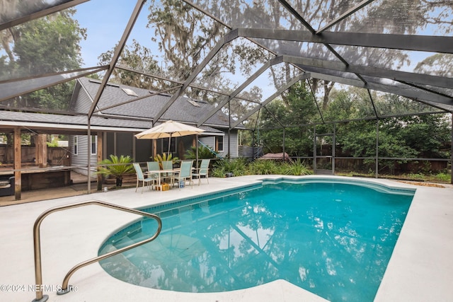 view of pool featuring a lanai and a patio area