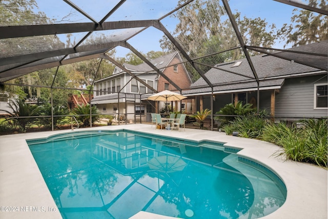 pool with a patio and a lanai