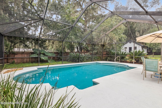 view of pool featuring a patio and a lanai