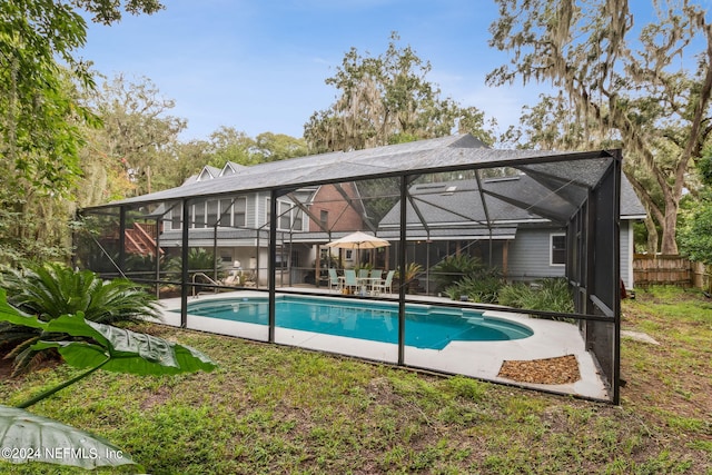 view of pool with a lanai and a patio area