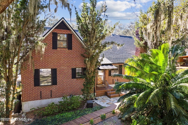 view of front of home featuring brick siding