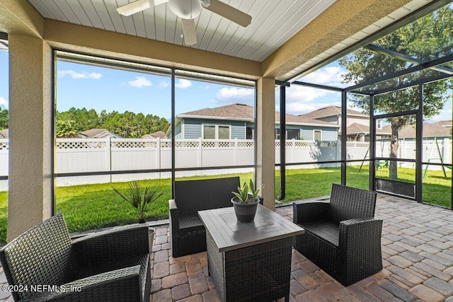 sunroom / solarium with ceiling fan