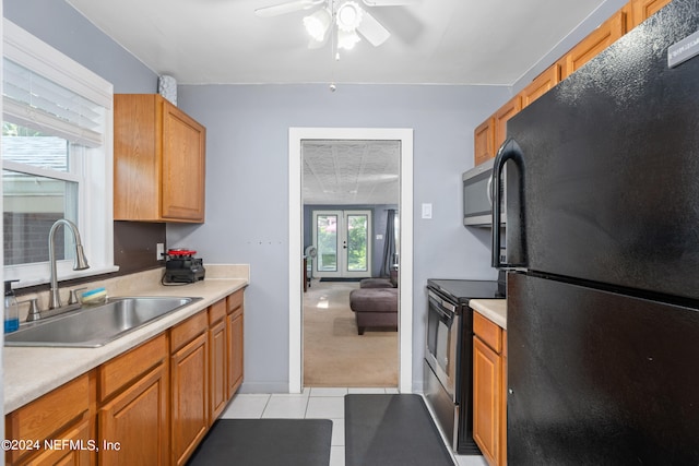 kitchen featuring a healthy amount of sunlight, ceiling fan, stainless steel appliances, and sink