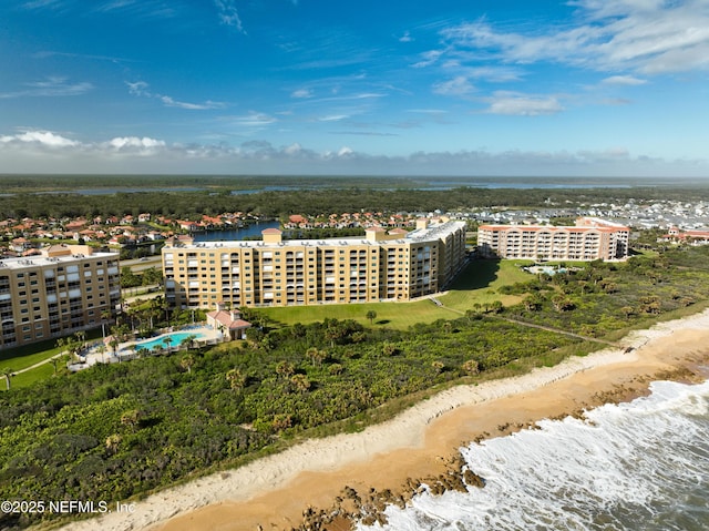 aerial view featuring a view of the beach and a water view