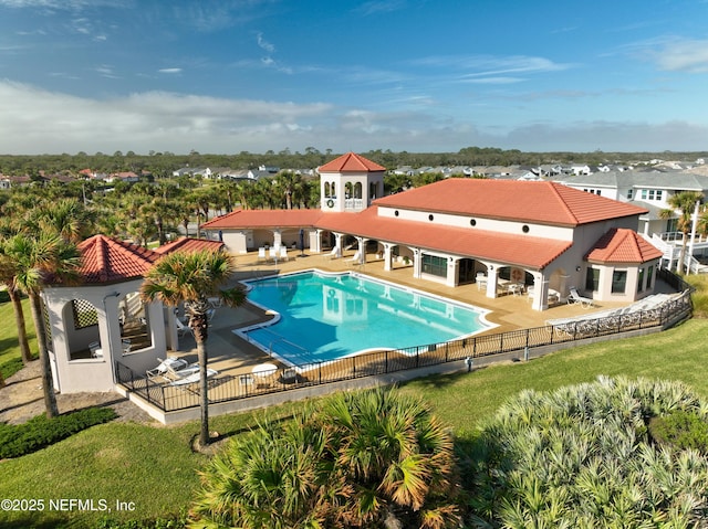 view of swimming pool with a lawn and a patio