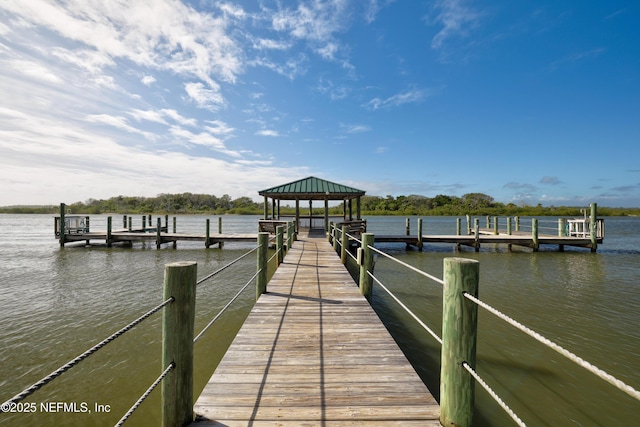 dock area with a gazebo and a water view