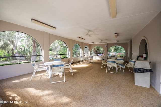 view of patio featuring ceiling fan