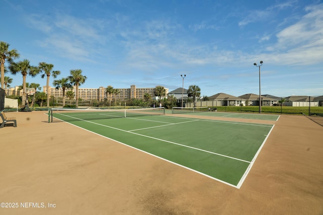 view of sport court with basketball hoop