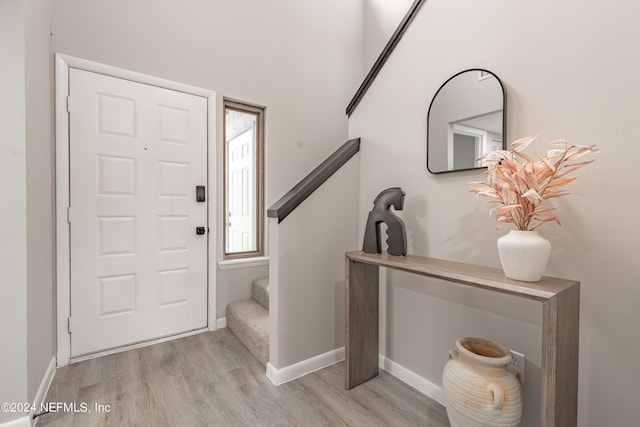 9360 Craven Rd Unit 504, Jacksonville, FL 32257 - foyer entrance featuring stairs, wood finished floors, and baseboards