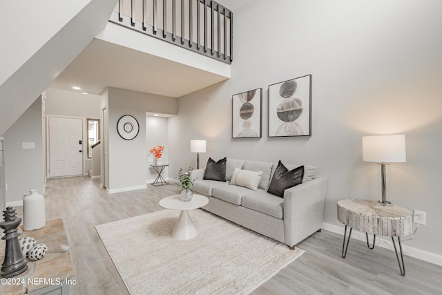9360 Craven Rd Unit 504, Jacksonville, FL 32257 - living room with a high ceiling, baseboards, light wood finished floors, and recessed lighting