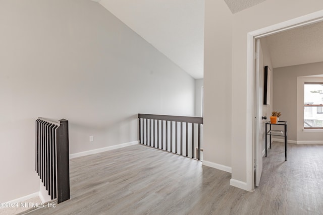 9360 Craven Rd Unit 504, Jacksonville, FL 32257 - additional living space featuring baseboards, wood finished floors, and vaulted ceiling