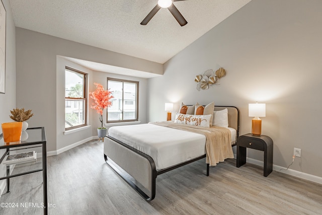 9360 Craven Rd Unit 504, Jacksonville, FL 32257 - bedroom featuring vaulted ceiling, baseboards, and light wood finished floors