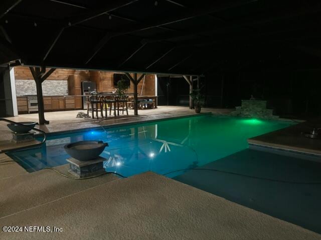 view of swimming pool featuring a patio