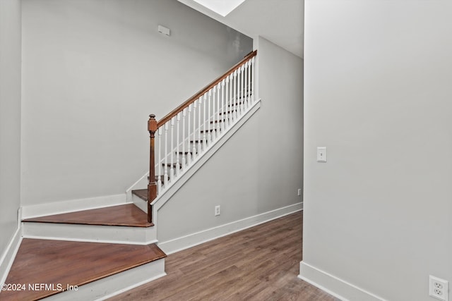 stairs with wood-type flooring