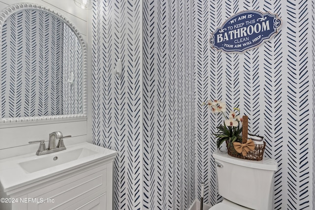 bathroom with toilet and vanity