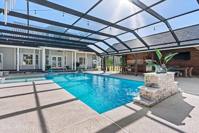 view of pool with a patio, ceiling fan, a lanai, and exterior bar