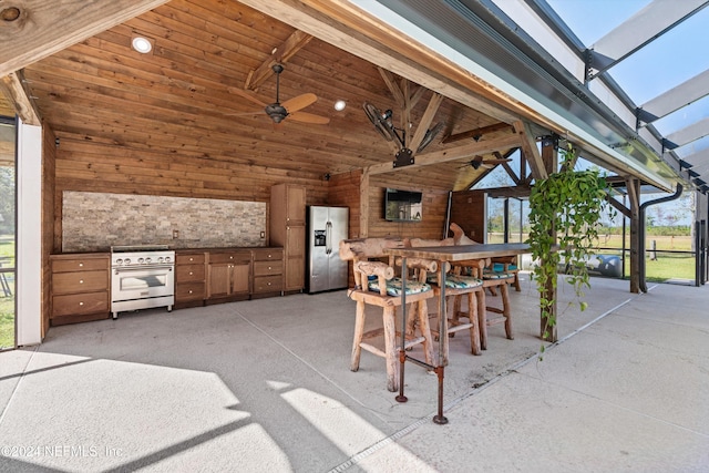 view of patio / terrace with a gazebo, glass enclosure, an outdoor bar, and ceiling fan