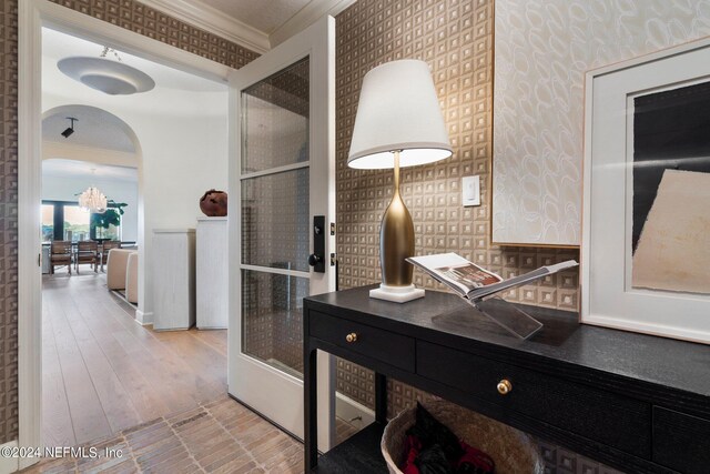 bathroom with hardwood / wood-style floors, an enclosed shower, crown molding, and vanity