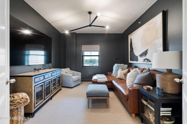 living room with light carpet and a textured ceiling