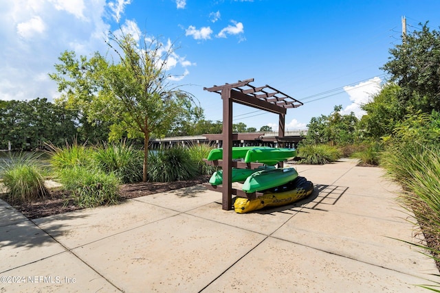 surrounding community featuring a patio and a pergola