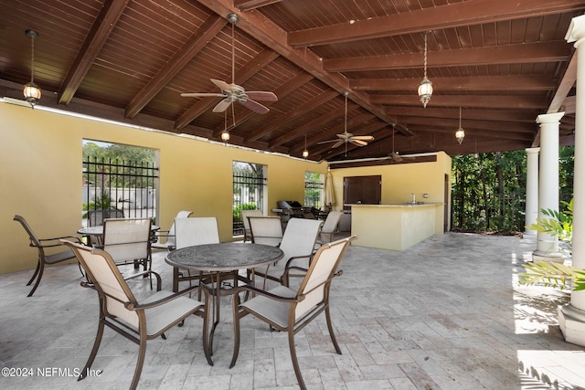 view of patio with exterior kitchen and ceiling fan