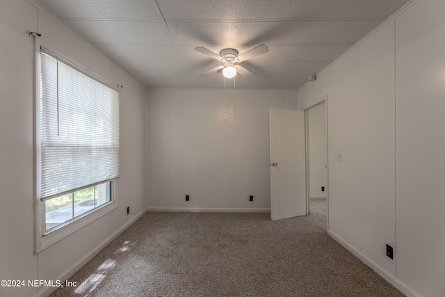 carpeted empty room with ceiling fan