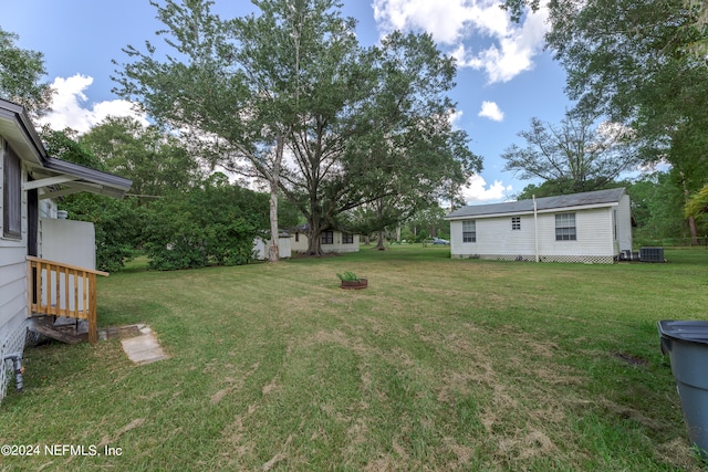 view of yard featuring central AC