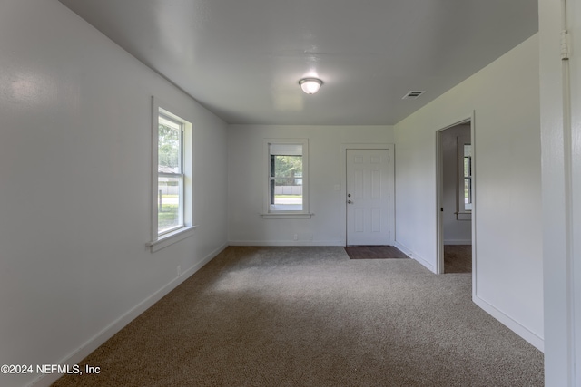 spare room with carpet floors